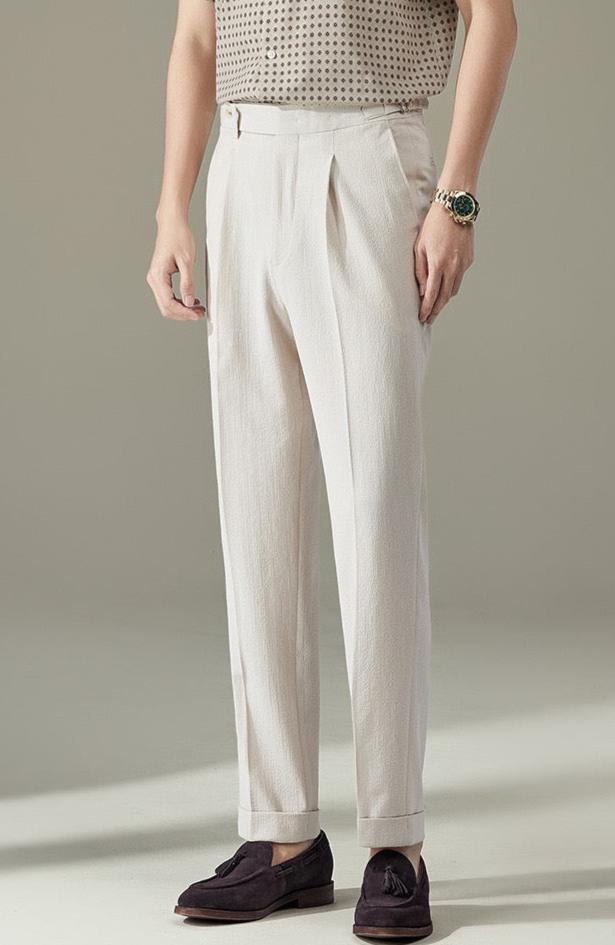 Pointed buttoned pleated pants